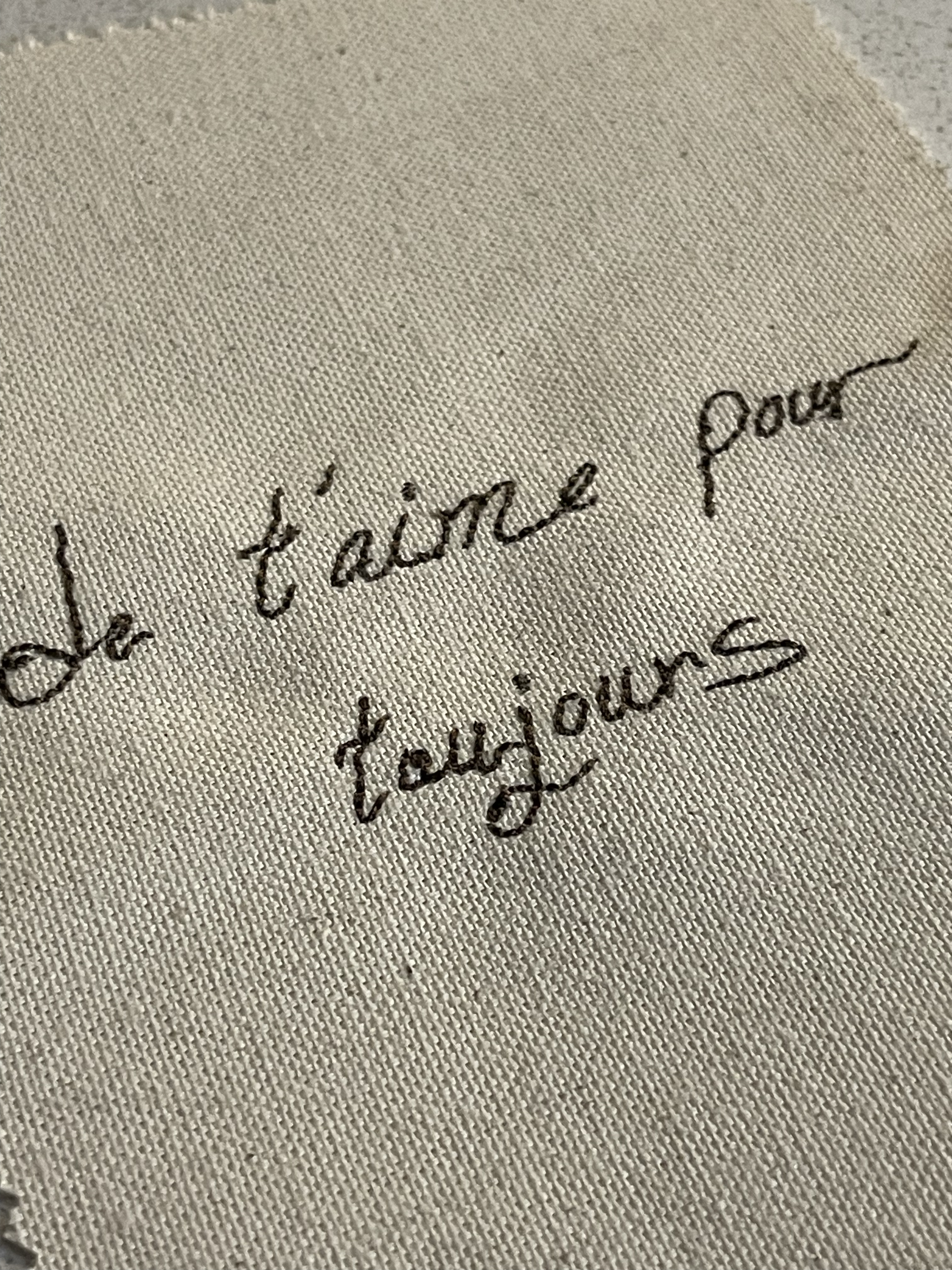 Original brown French handwriting embroidery detail